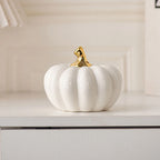 White and gold ceramic pumpkin – autumn and Christmas table decoration