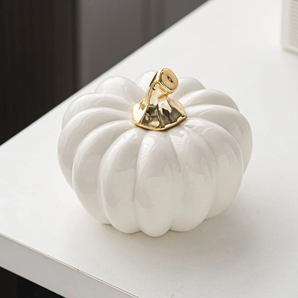 Gold-stem pumpkin ornament close-up – glossy ceramic finish