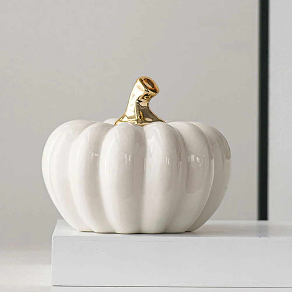 White ceramic pumpkin ornament styled on white console – elegant home décor