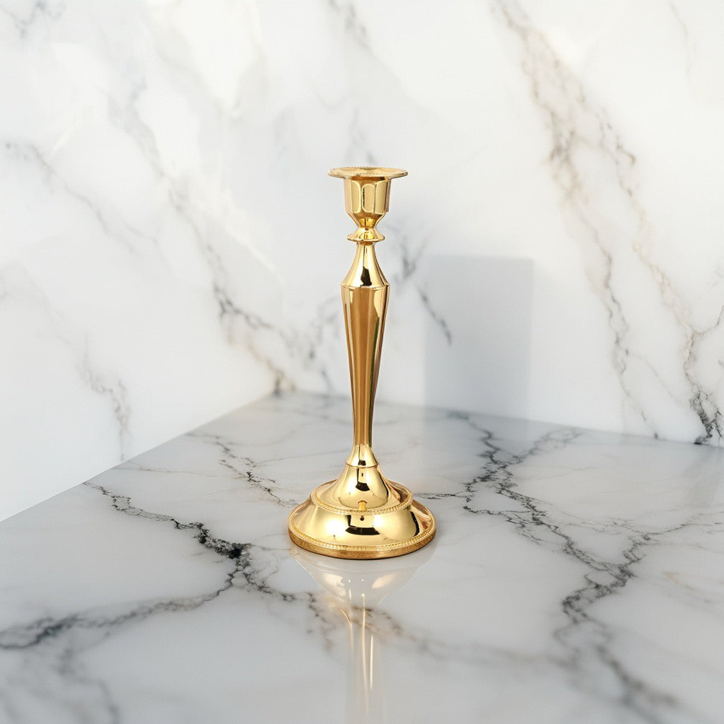 Elegant gold taper candle holder in metallic finish for festive interiors