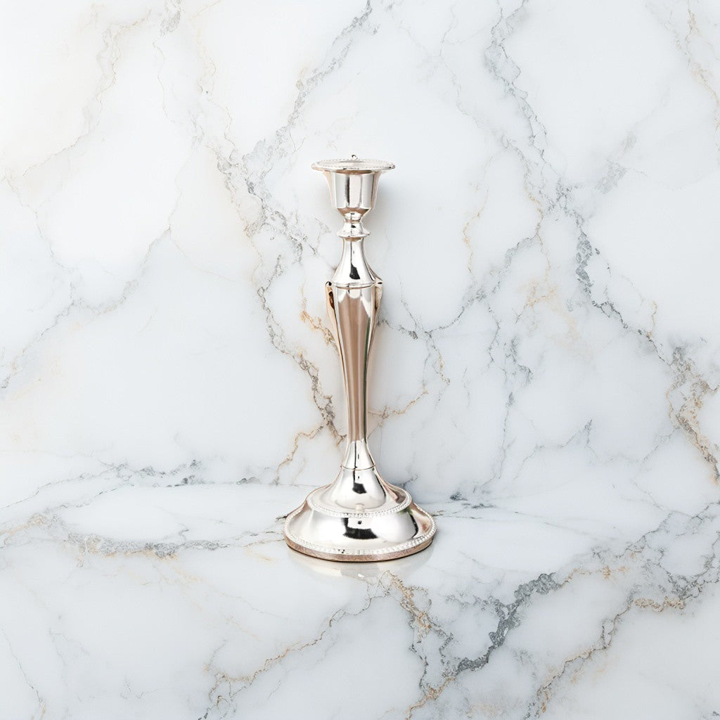 Elegant silver taper candle holder in metallic finish for festive interiors