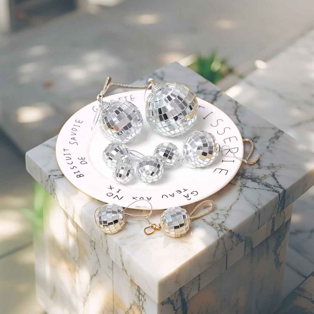 Mini silver disco ball Christmas ornament, 3cm diameter, featuring mirrored mosaic tiles - reflective festive décor accent