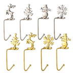 Set of gold and silver metal Christmas stocking holders – reindeer, snowflake, snowman and tree motifs