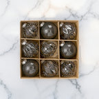 Icy silver Christmas bauble set of nine with frosted, metallic, and mirror finishes - cool-toned ornaments for modern Nordic Christmas décor
