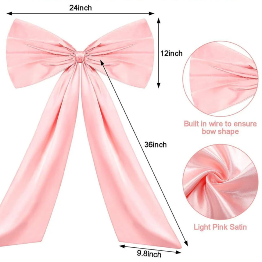 Large pink satin bow decoration for Christmas tree topper, wedding or party décor, versatile festive wall and event styling accent