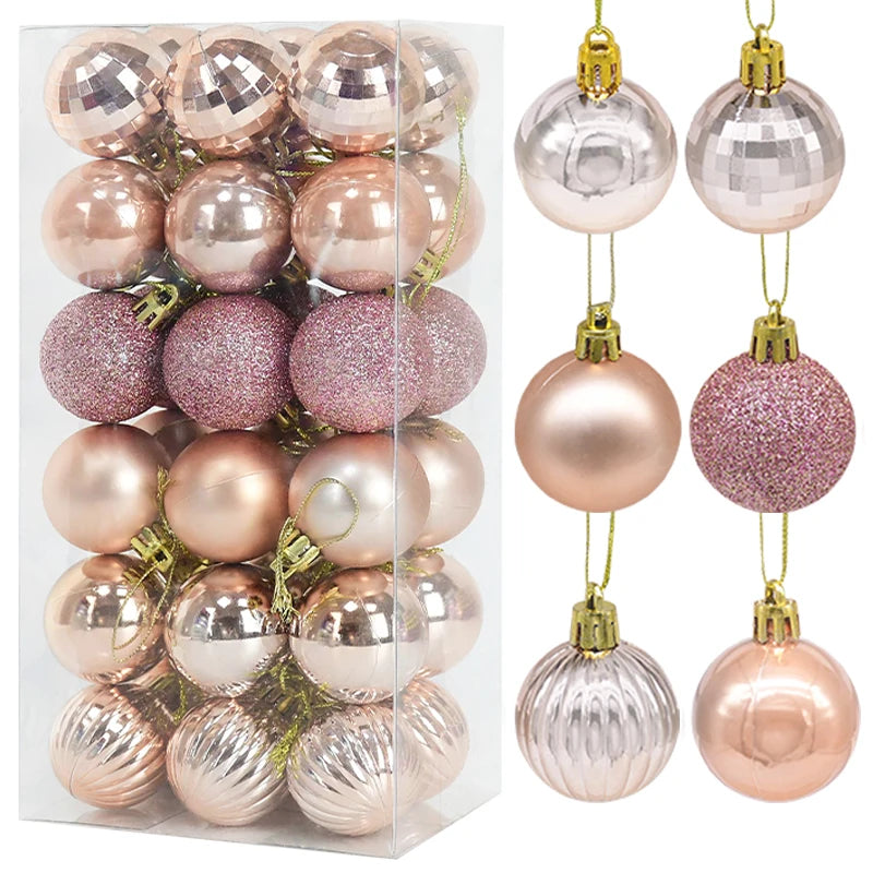 Set of rose gold Christmas baubles in assorted finishes - matte, glitter, and metallic - presented in clear packaging for elegant festive styling