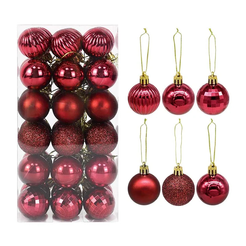Set of plum red Christmas baubles in assorted finishes - matte, glitter, and metallic - presented in clear packaging for elegant festive styling