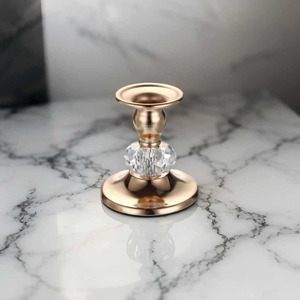 Vintage gold crystal candle holder with faceted glass base displayed on marble - elegant decorative piece for festive or everyday styling