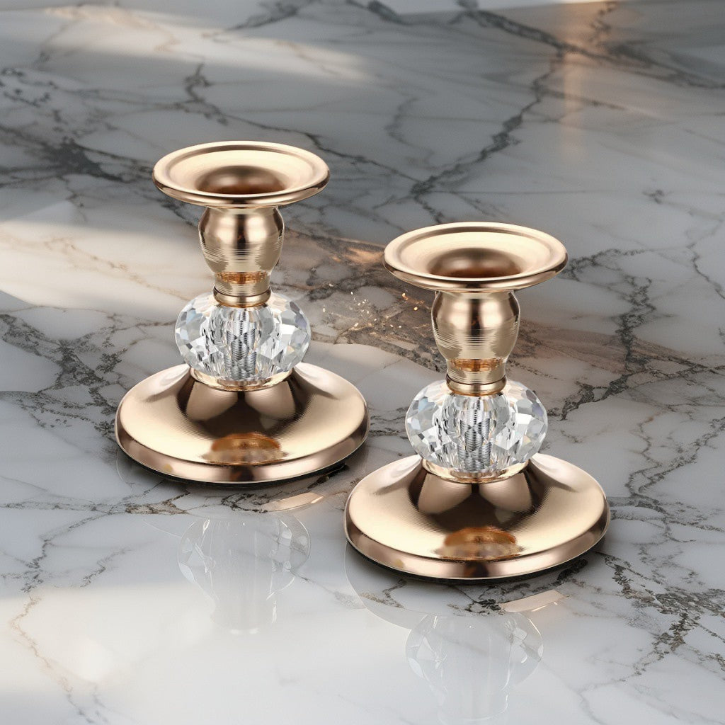 Vintage gold crystal candle holders with faceted glass base displayed on marble - elegant decorative piece for festive or everyday styling